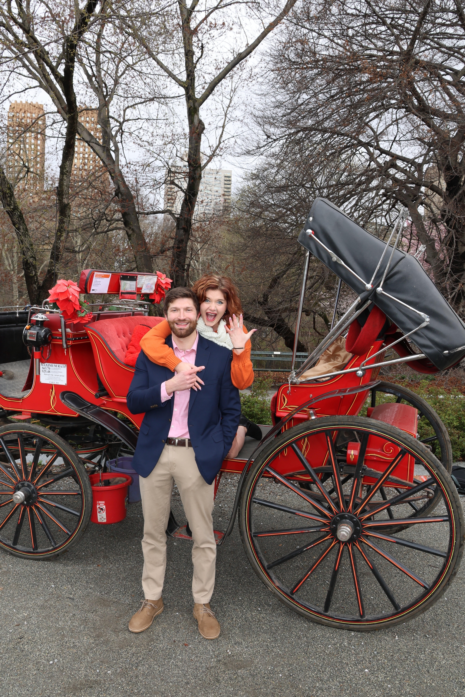 Savanna & Conner in front of a carriage