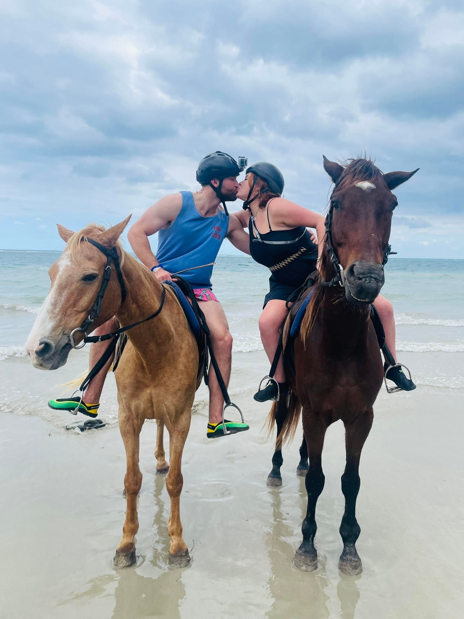 Savanna & Conner kissing on horseback